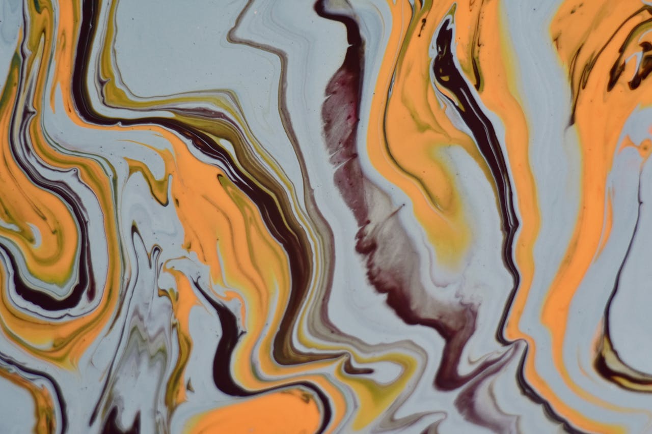 A captivating abstract artwork featuring vibrant swirls of yellow, orange, and brown hues.